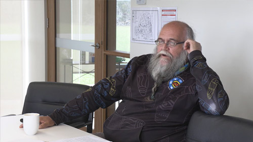 Dale McDonald sitting in a couch discussing his life experiences of been Aboriginal